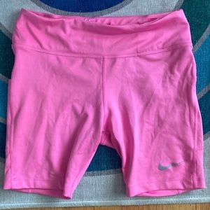 Bright pink Nike biker shorts with pockets